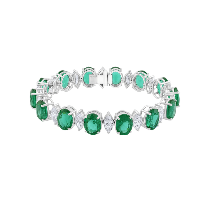 Bracelet with green gemstones and silver accents on a white background