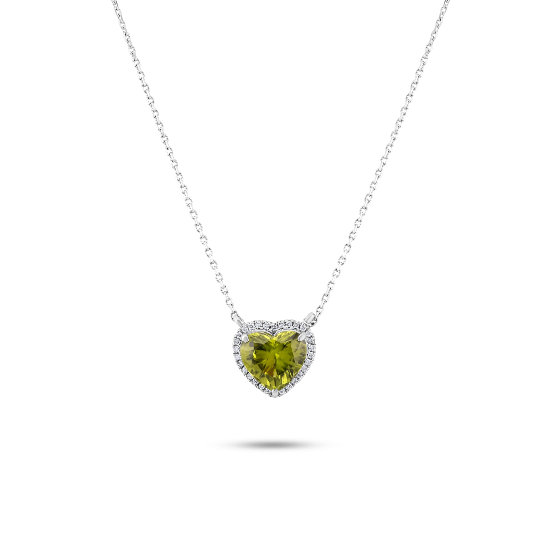 Gold necklace with a blue gemstone pendant on a white background