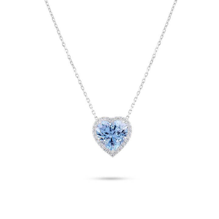 Heart-shaped blue gemstone necklace on a white background