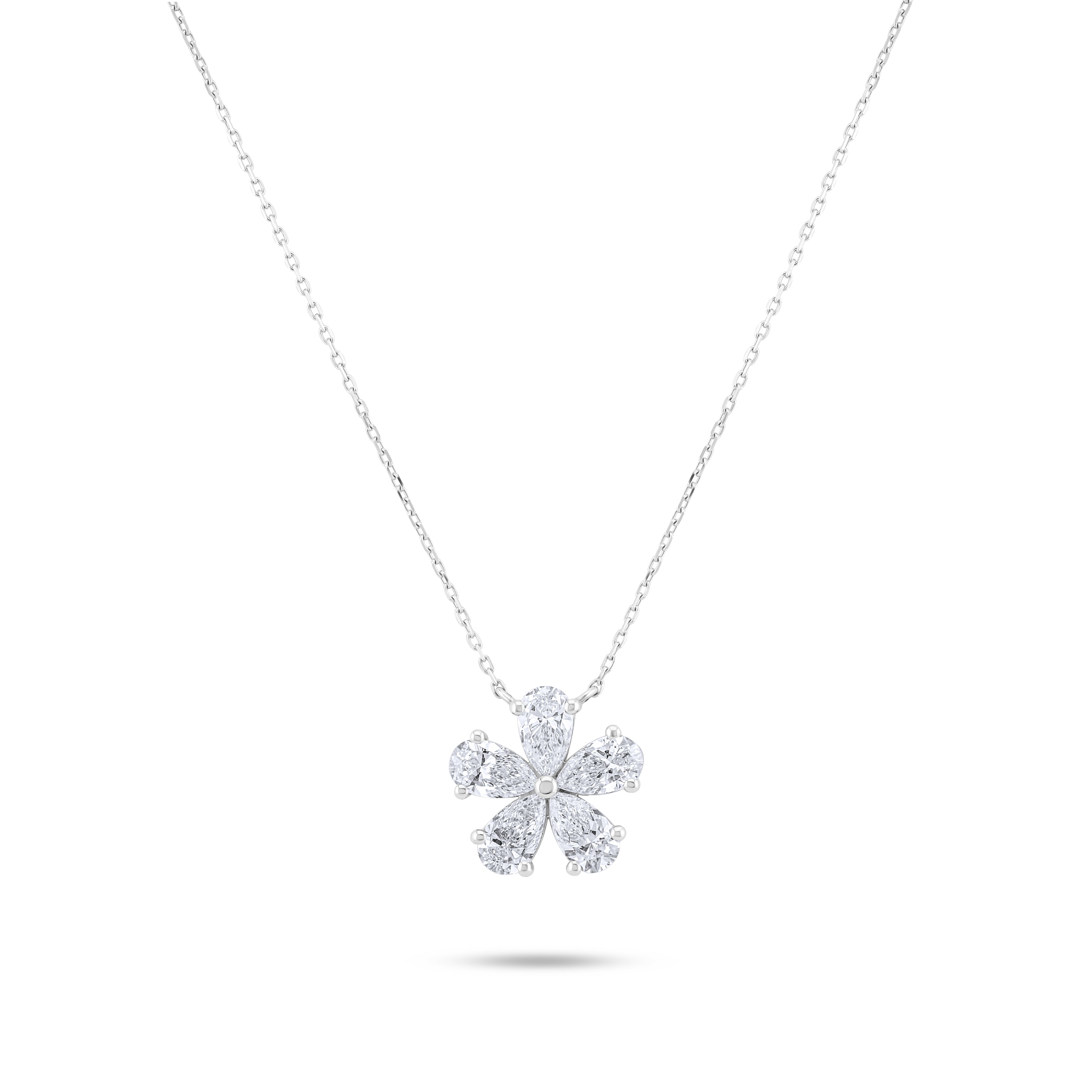 Diamond flower pendant on a chain against a white background