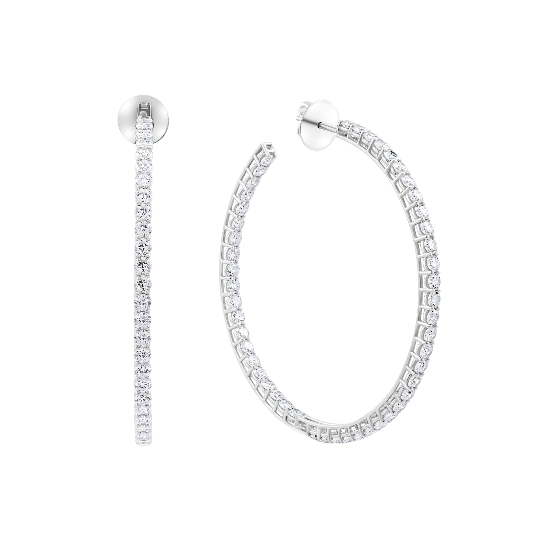 Pair of silver hoop earrings on a white background