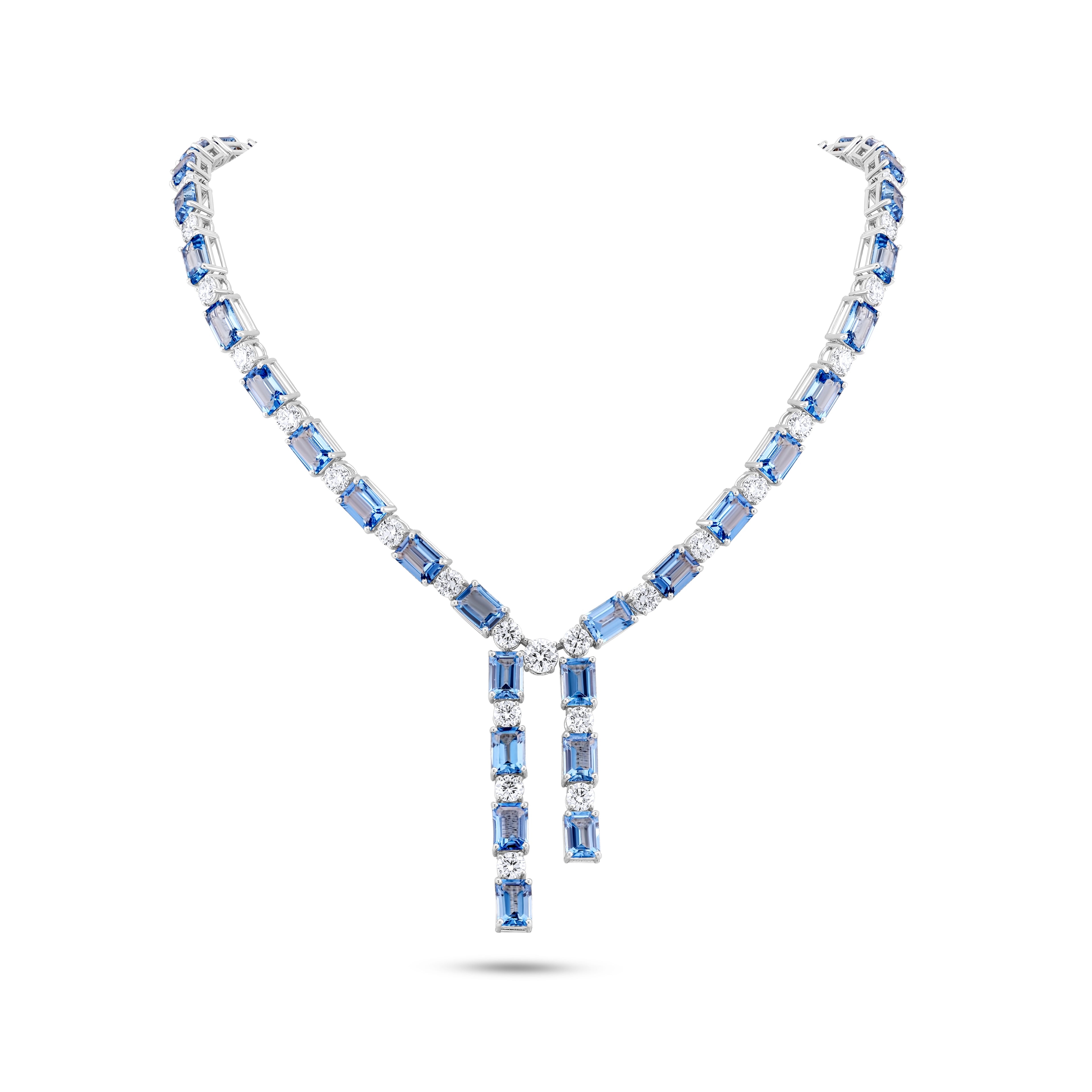 Elegant necklace with blue gemstones on a white background