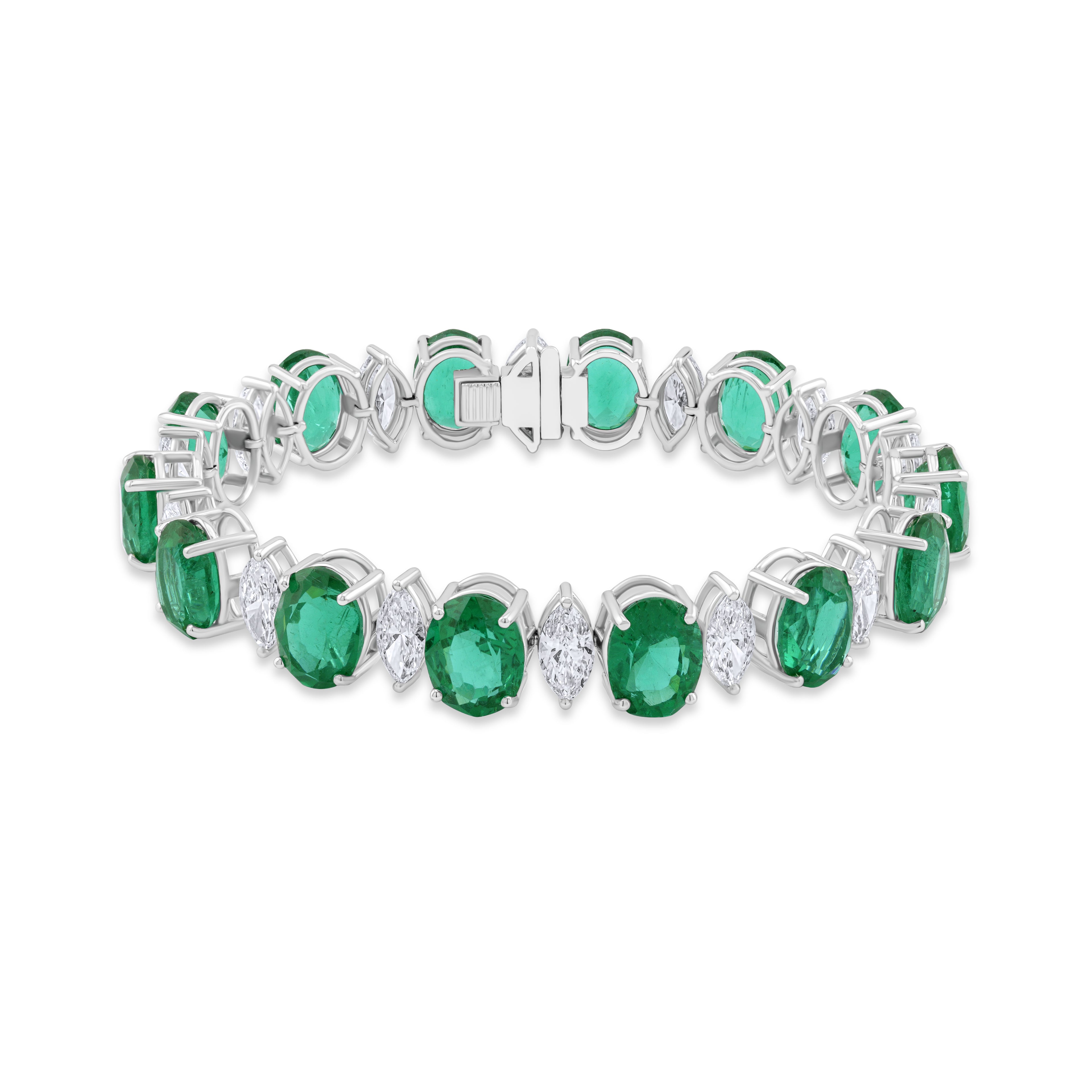 Emerald and diamond bracelet on a white background