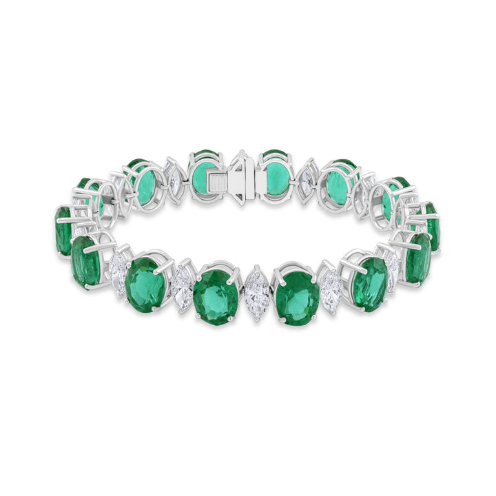 Emerald and diamond bracelet on a white background