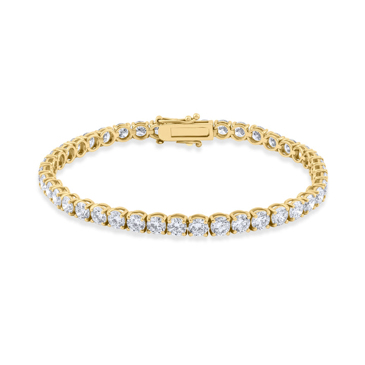 Gold bracelet with clear stones on a white background
