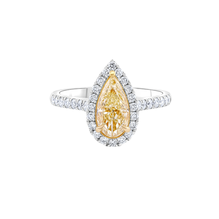 Diamond ring with a pear-shaped yellow diamond on a white background