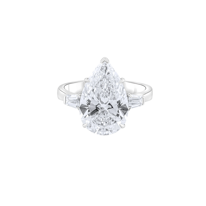 Diamond ring with a pear-shaped center stone on a white background