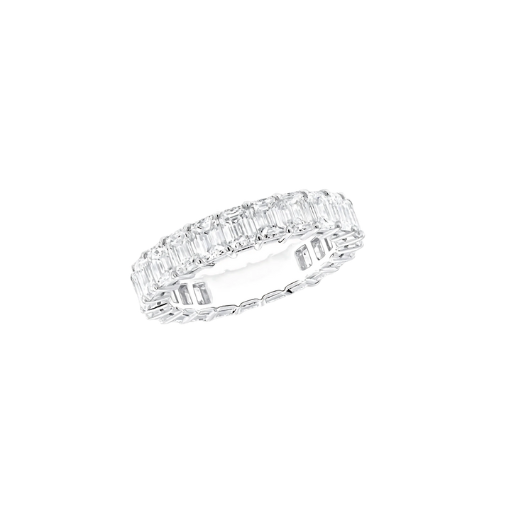 Diamond ring with emerald-cut stones on a white background