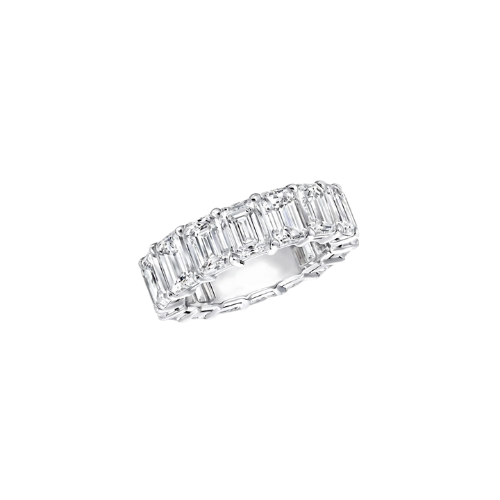 Diamond ring with emerald-cut stones on a white background