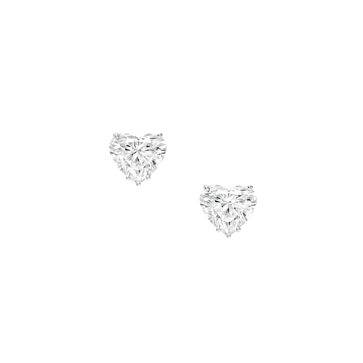 Heart-shaped diamond earrings on a white background