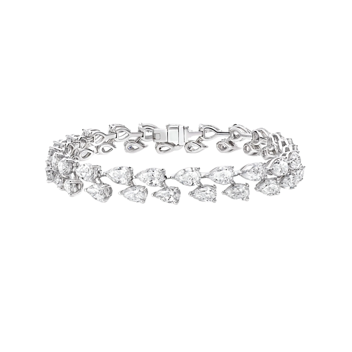 Silver bracelet with clear gemstones on a white background