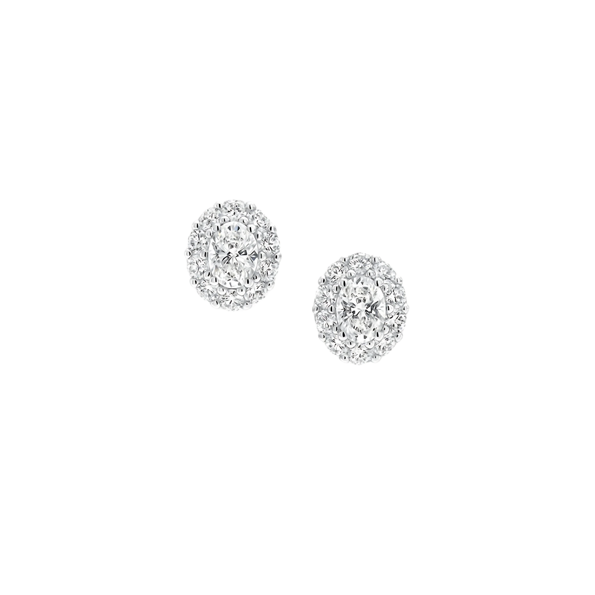 Pair of silver earrings with clear gemstones on a white background
