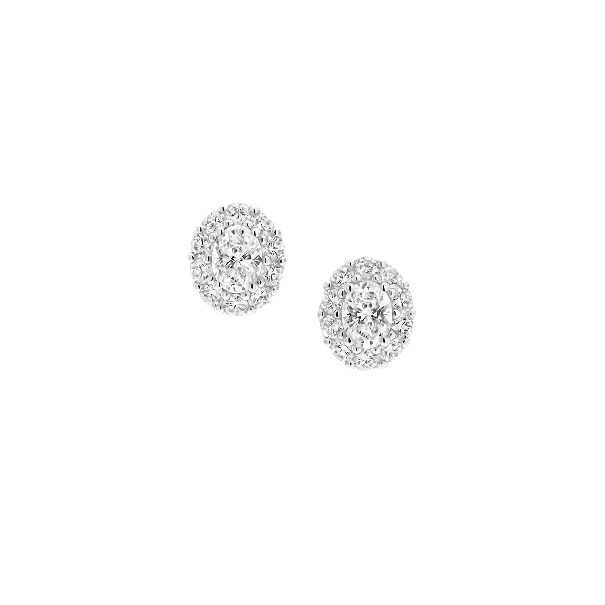 Pair of silver earrings with clear gemstones on a white background