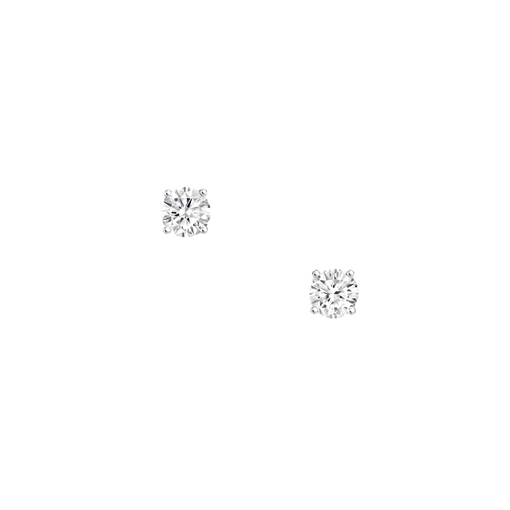 Pair of diamond stud earrings on a white background
