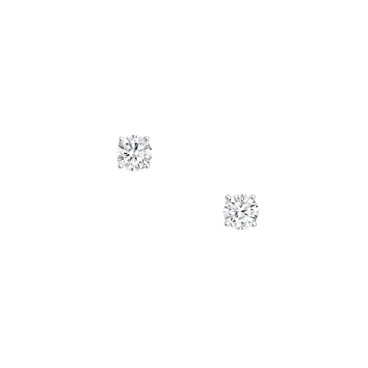 Pair of diamond stud earrings on a white background
