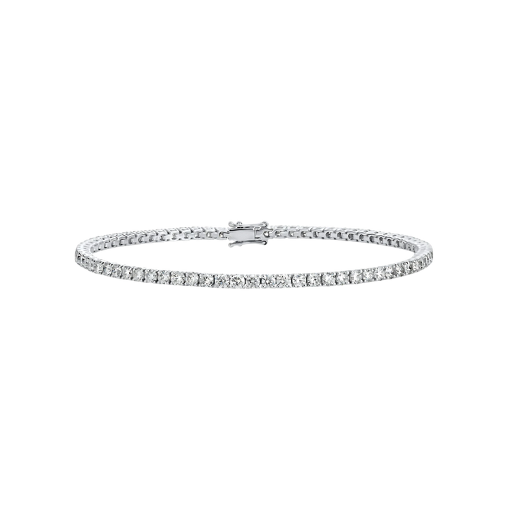Silver bracelet with clear stones on a white background